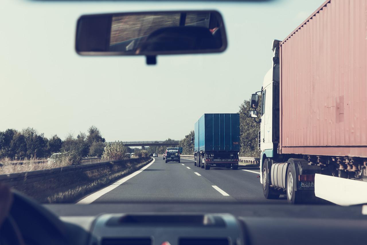 What distance should you leave behind a truck?